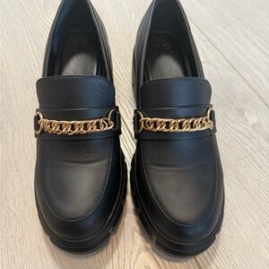 JustFab Black Loafers with Gold Chain Detail